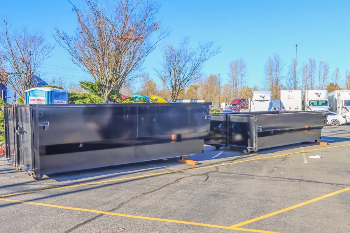 Professional dumpster rental service with roll-off container on residential driveway in Tredyffrin